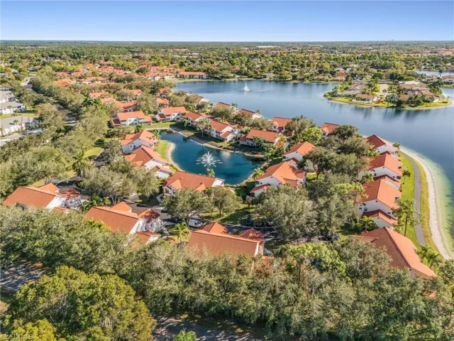 Aerial perspective of suburban area featuring a large body of water