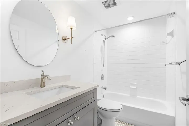 Full bath featuring vanity, bathtub / shower combination, and recessed lighting