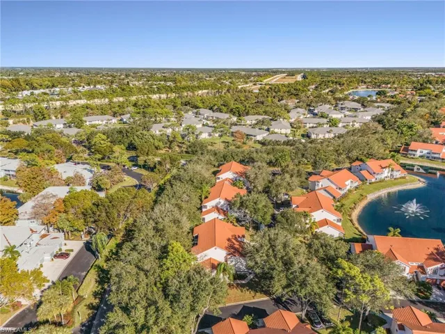 Aerial view of residential area featuring a large body of water