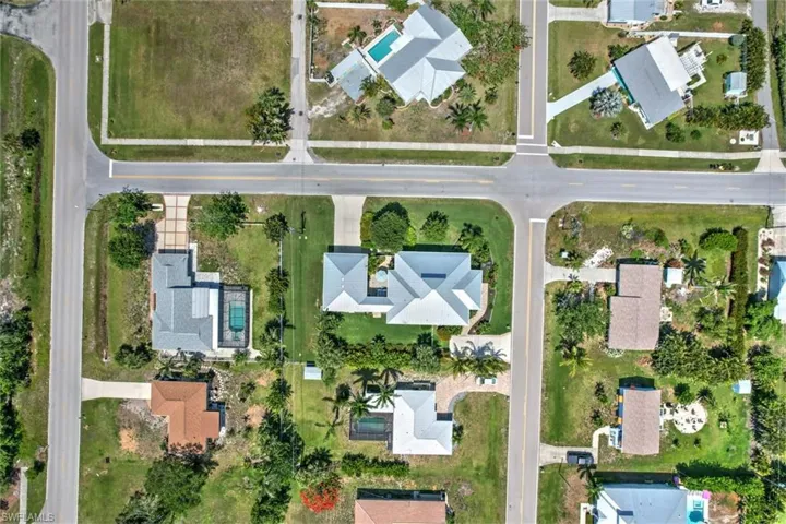 Aerial overview of property's location featuring nearby suburban area