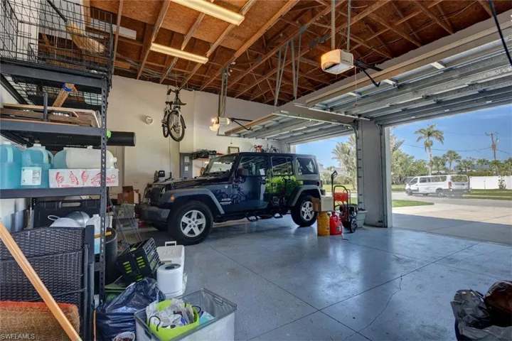 Garage featuring a garage door opener