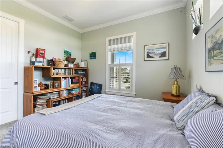 Bedroom featuring crown molding