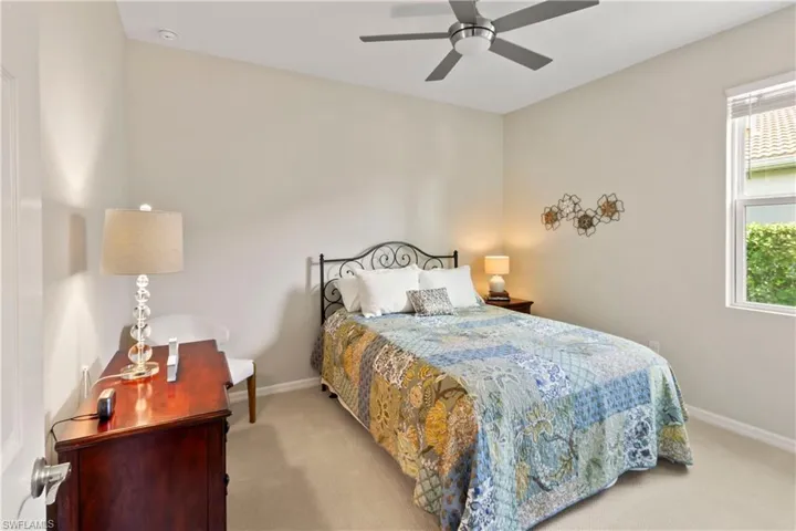 Bedroom with carpet flooring and a ceiling fan