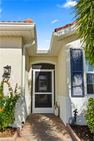 Entrance to property with stucco siding