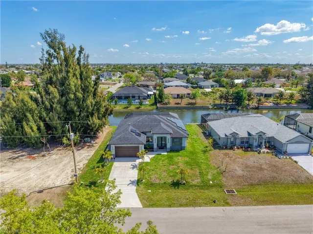 Aerial view of residential area with a large body of water