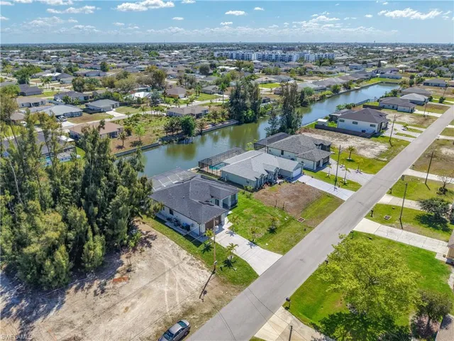 Aerial view of residential area with a nearby body of water
