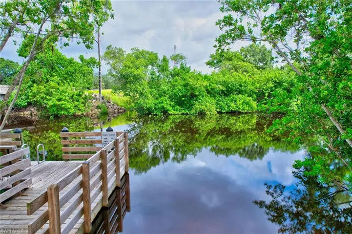 Dock area featuring a water view