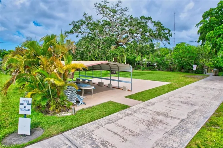 View of home's community featuring a yard
