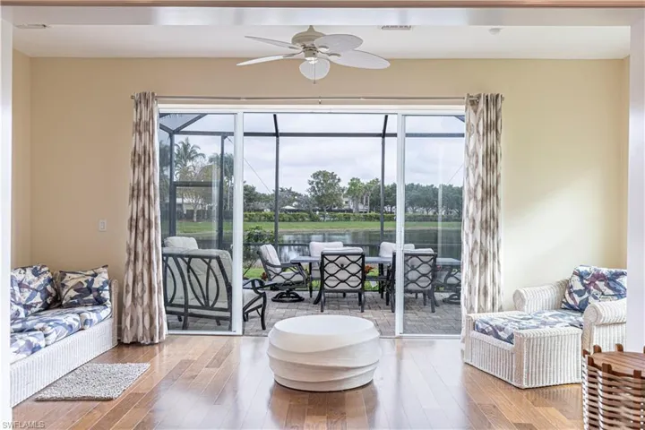 Living area featuring ceiling fan and wood-type flooring