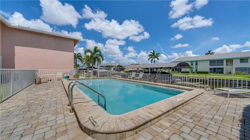 Community pool featuring a patio area