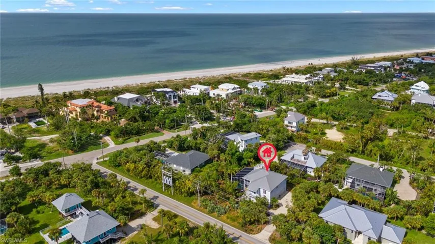 Bird's eye view featuring a beach view and a water view