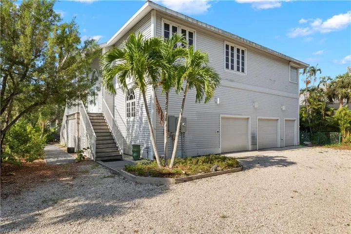 View of property exterior featuring a garage