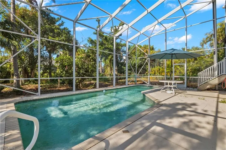 View of pool featuring a patio and a lanai