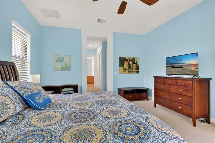 Primary Bedroom showing en-suite and closets
