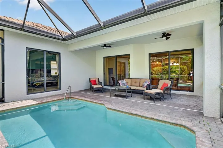 Screened Pool with views from Primary bedroom/living area/dining area.  All impact glass