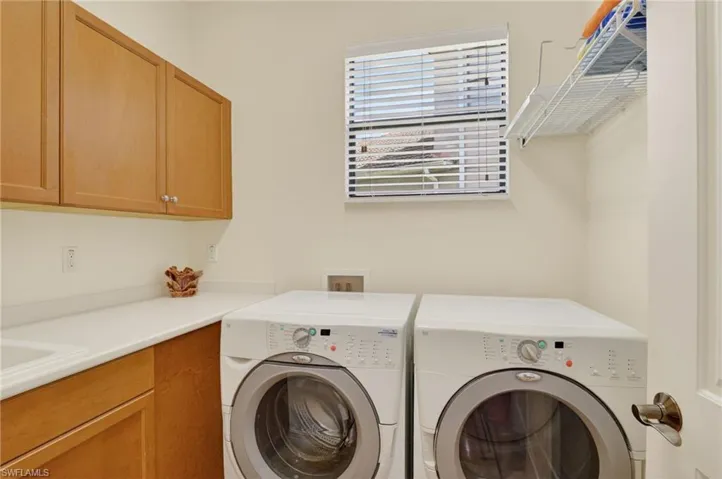 Laundry with soaking tub, folding area & rack