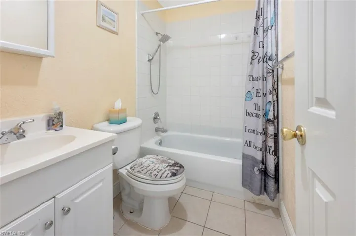 Full bathroom with tile floors