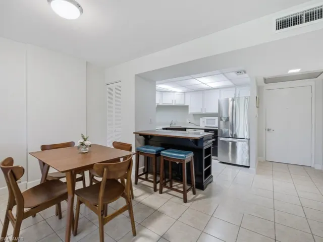 Dining along with island setup between kitchen