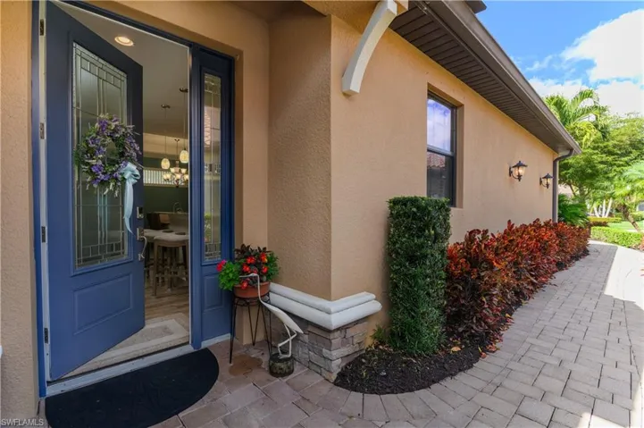Beautiful side entrance w/paved landscaped walkway