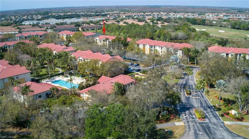 Entrance to Royal Greens; Clubhouse to left, basketball court at far left (in front of pool).