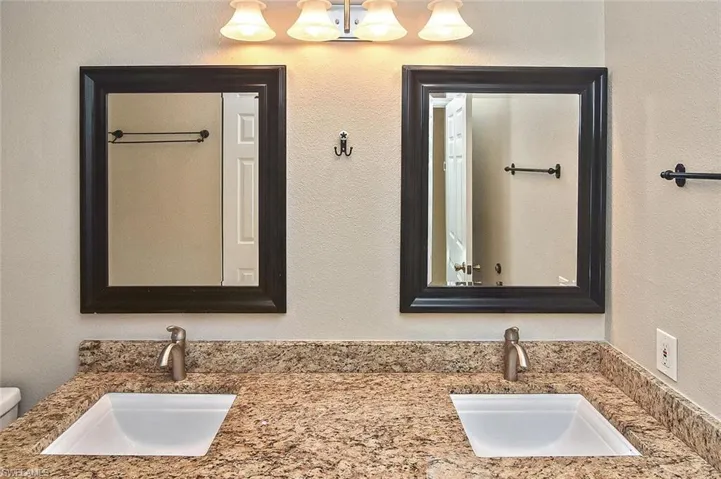 Gorgeous updated mirrors and light fixture.