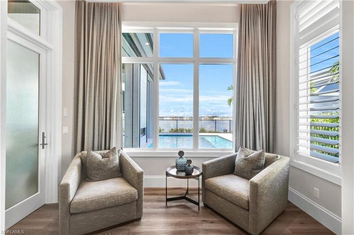 Master bedroom sitting area with door that leads to the outdoor pool and living area