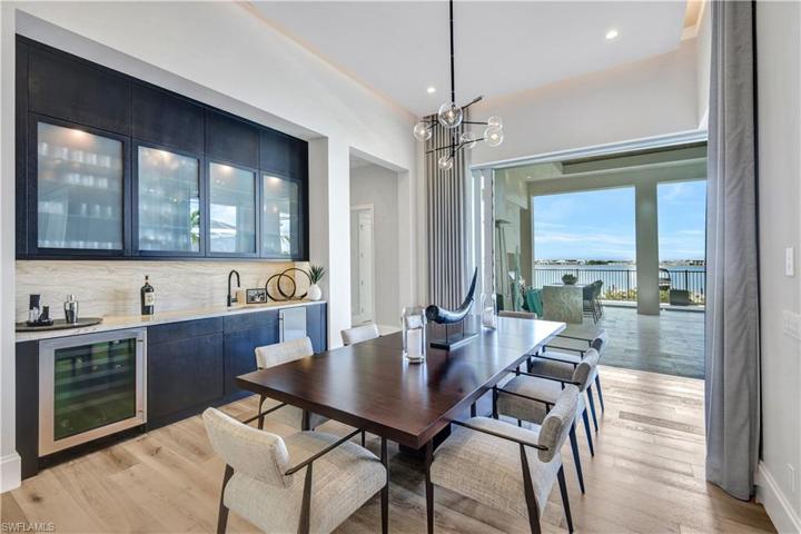 Wine refrigerator and icemaker within easy access of dining table