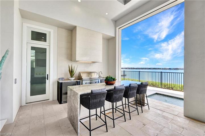 Outdoor Gas Grill, Hood, Refrigerator, and wet sink/bar area