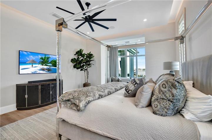 Master bedroom with custom ceilings and sitting area