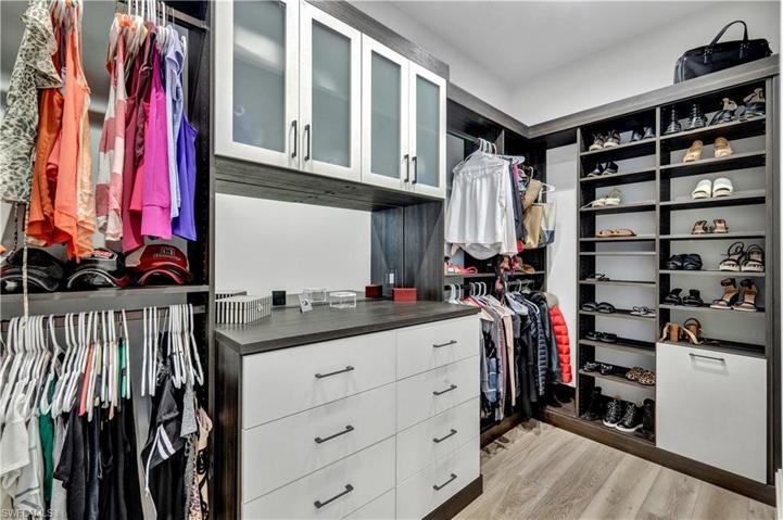 Master bedroom has both his and hers closets with built-in organizers