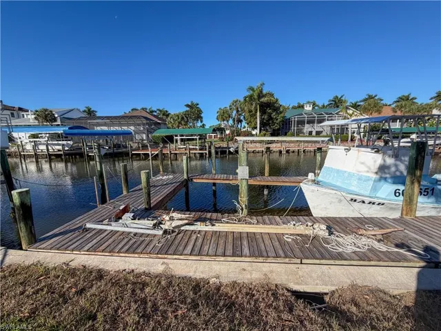 Dock area featuring a water view