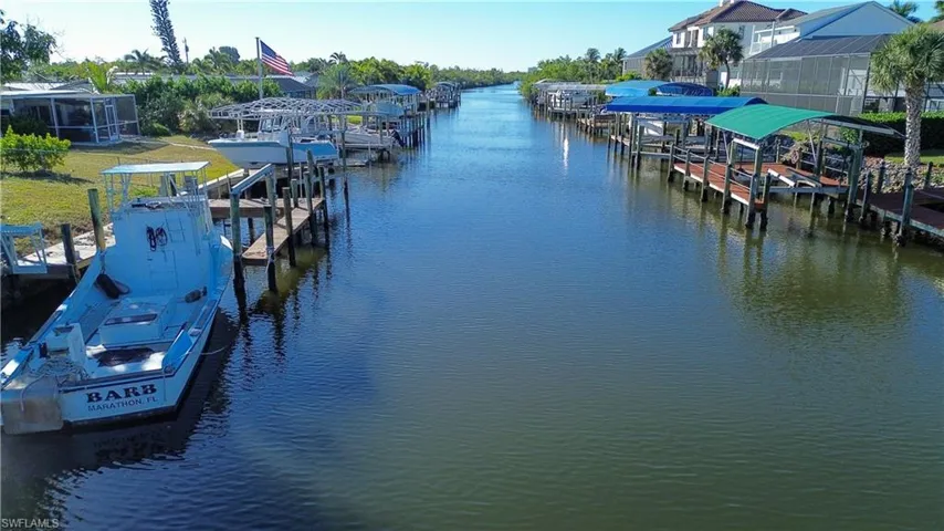 Dock area with a water view and boat lift