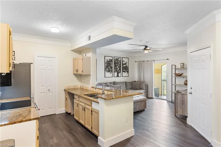 Overview of kitchen and living room (front door is on the right) from the breakfast nook.