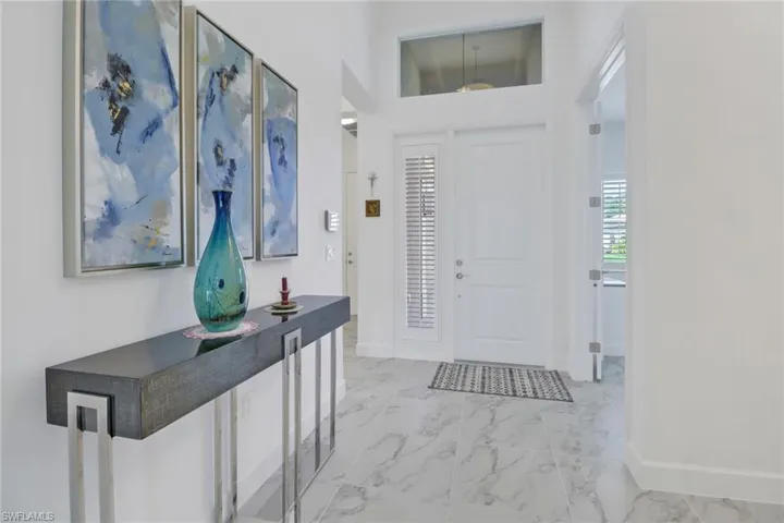 Entrance foyer with tile patterned floors