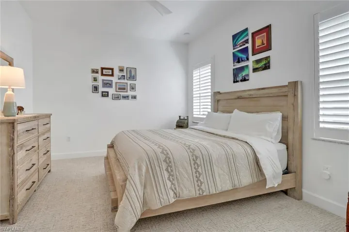 Bedroom with light carpet
