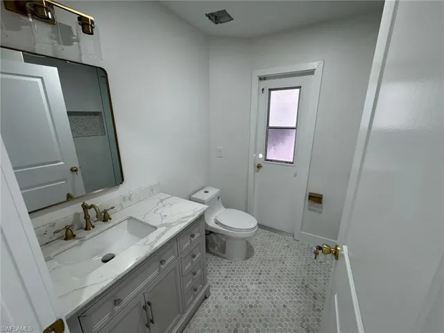 Bathroom with vanity and a shower