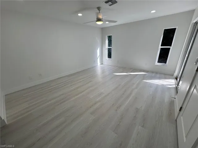 Unfurnished room featuring light wood finished floors, recessed lighting, and ceiling fan