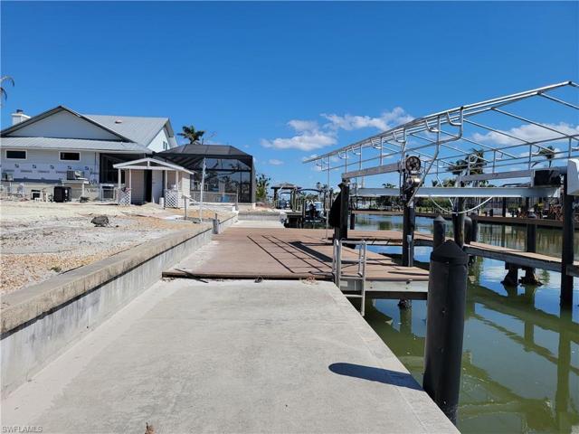 METAL FRAME BOAT COVER AND CATWALK PLUS LARGE CONCRETE DOCK