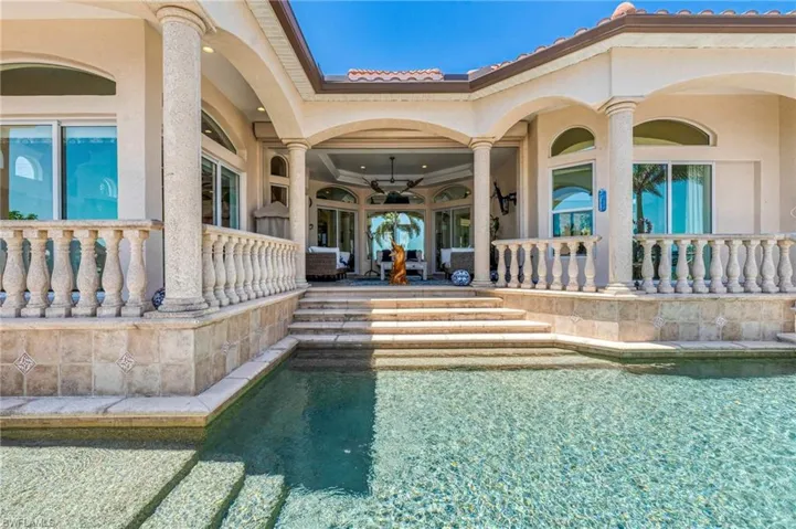 Swimming pool with a patio and ceiling fan