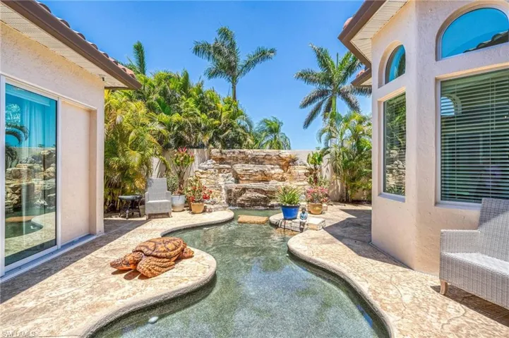 Fenced backyard with a patio