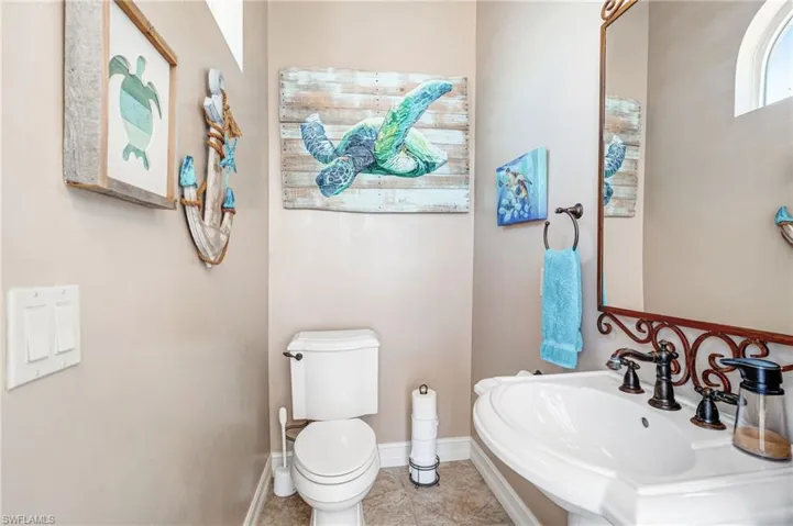 Bathroom with toilet and tile patterned floors