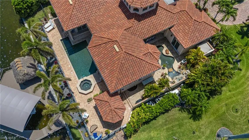 View of subject property featuring a pool area