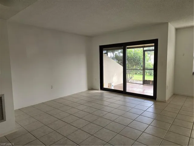 Living/Dining area with  light tile flooring