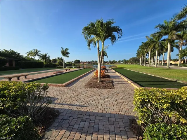 View of property's community featuring a yard