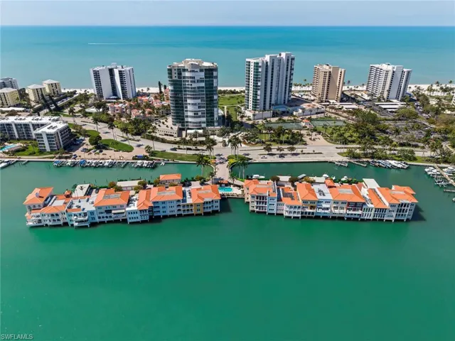 View of urban area featuring numerous boat docks and a nearby body of water