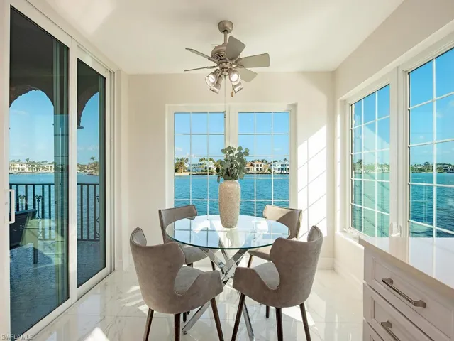 Sunroom / solarium featuring ceiling fan