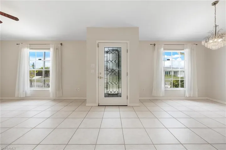 Front door, formal living room on left, formal dining room on right