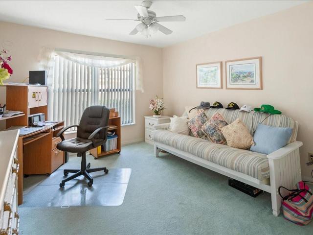 Guest bedroom overlooks the paver courtyard. It has two double closets and a futon.