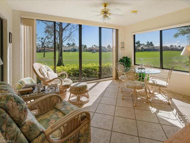 Glassed and screened lanai overlooks the golf course.