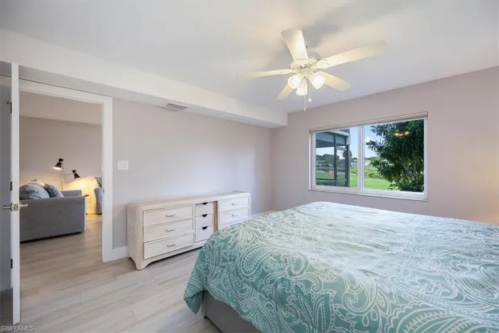 Bedroom featuring ceiling fan and light wood-type flooring